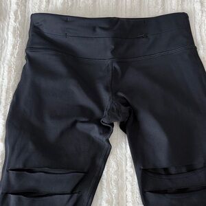 Nancy Rose Performance Black Leggings with slashed mesh detail on front legs